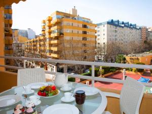 a table with a bowl of fruit on a balcony at Apartment Apolo VII-5 by Interhome in Calpe