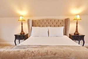 A bed or beds in a room at Dene Annexe, Durham