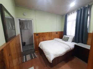 Postel nebo postele na pokoji v ubytování Kanari B&B