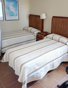 Cama o camas de una habitación en Costa Ballena Torresalada 1