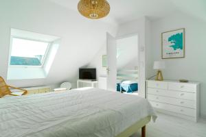Ein Bett oder Betten in einem Zimmer der Unterkunft Penn Odet - vue mer