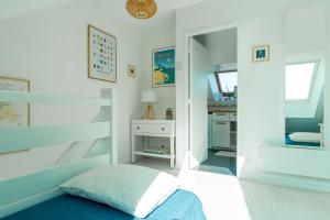 Ein Bett oder Betten in einem Zimmer der Unterkunft Penn Odet - vue mer