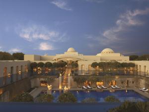 a rendering of the exterior of a resort with a swimming pool at Trident Gurgaon in Gurgaon