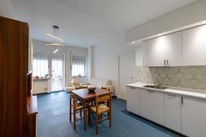 a kitchen with a table and a dining room at Casa Simo Apartment in Castel di Sangro