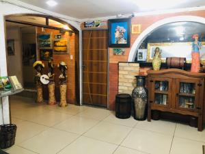 a room with two people standing in a room at Hotel Orla Guest House in Petrolina