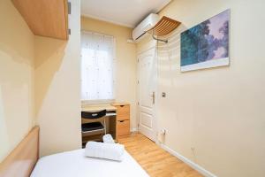 Łóżko lub łóżka w pokoju w obiekcie Tranquilo apartamento Pacífico/Ciudad de Barcelona