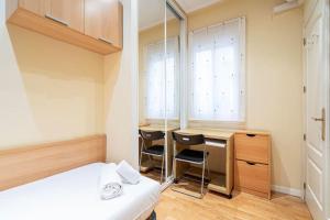 Łóżko lub łóżka w pokoju w obiekcie Tranquilo apartamento Pacífico/Ciudad de Barcelona