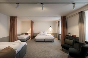 Postel nebo postele na pokoji v ubytování Hotel Augustyn Brugge + 37 fotografií