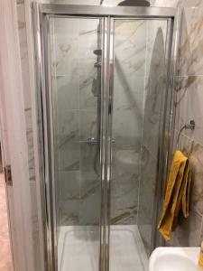 a shower with a glass door in a bathroom at Two Bedroom End Terrace House near Birchington High Street in Birchington