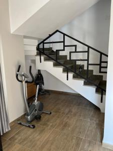 a gym with stairs and exercise equipment in a house at Luxorious villa with a pool near the laguna in Dahab