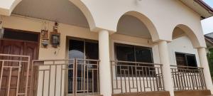 a house with arches on the front of it at Afrikan Regent Nana Guest Lodge 2 BedRoom at East Legon KFC Wi-Fi Dstv Water old in Accra