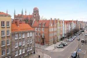 a view of a city street with buildings and cars at City & Old Town View Rooftop by Downtown Apartments in Gdańsk