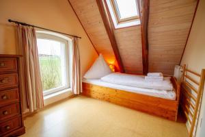 Postel nebo postele na pokoji v ubytování Ferienhaus Utkiek