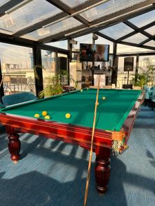 a pool table with balls on it on a deck at Hotel Old Town in Batumi
