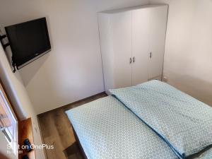 Postel nebo postele na pokoji v ubytování Ferienwohnung Grete, an der Weinstraße