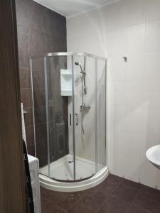 a shower stall in a bathroom with a sink at Hampton Court, Block C, n.2 in St. Paul's Bay