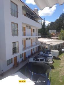 a group of boats parked outside of a building at Wayra Hospedaje in Cajamarca +21 photos