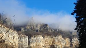 a mountain with clouds on top of it at Къща за гости Марчела и Ресторант Мъри in Gara Lakatnik +2 photos