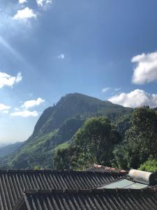 a view of a mountain from a house at Green View Ella in Ella