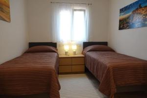 A bed or beds in a room at Infinity View