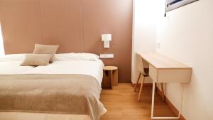 Postel nebo postele na pokoji v ubytování Hotel Ocamiño