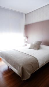 Postel nebo postele na pokoji v ubytování Hotel Ocamiño
