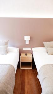 Postel nebo postele na pokoji v ubytování Hotel Ocamiño
