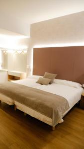 Postel nebo postele na pokoji v ubytování Hotel Ocamiño