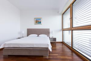 a bedroom with a bed and a large window at Villa Superior Two in Crikvenica +14 photos