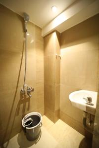 a bathroom with a toilet and a sink and a shower at CABIN STAY-SOCIAL HUBZ in Mumbai