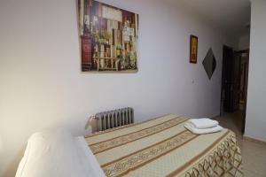 Postel nebo postele na pokoji v ubytování Hotel Virgen de los Reyes