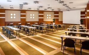 a dining room with tables and chairs and a whiteboard at Point Hotel Taksim in Istanbul +37 photos