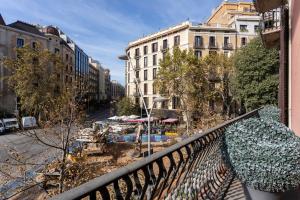 a balcony with a view of a city with buildings at Feelathome Casa Bertrand in Barcelona
