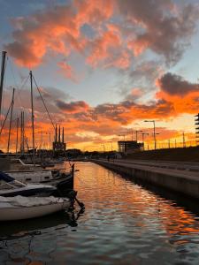 a group of boats docked in a marina at sunset at PRECIOSO BARCO EN EL PUERTO DE BADALONA in Badalona