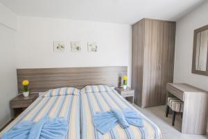Postel nebo postele na pokoji v ubytování Ayia Napa Holiday Apartment Ss1