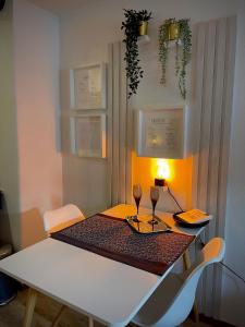 a dining room table with two wine glasses on it at Apartment three Rivers2 in Passau