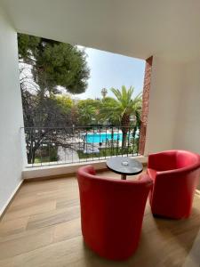 Bazén v ubytování Hôtel Volubilis nebo v jeho okolí