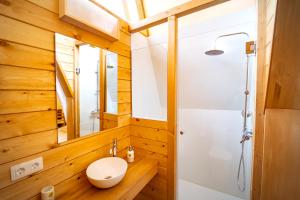 a bathroom with a toilet and a shower at Kampaoh Cambrils in Cambrils