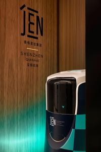 a toaster in front of a wall with a sign at Jen Shenzhen Qianhai By Shangri-La in Shenzhen
