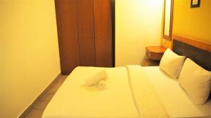 Postel nebo postele na pokoji v ubytování Leo Palace Hotel Classic Wing, WTC Kuala Lumpur