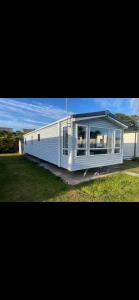 a large white building with a large window at Seaside chill in Prestatyn