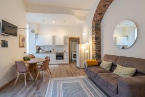 a living room with a couch and a table at Cernobbio Charming APT! in Cernobbio