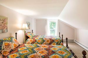a bedroom with two beds and a window at Manchester Center Retreat with Mtn View, Near Skiing in Manchester Center