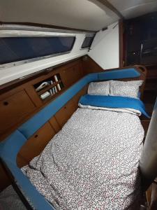 an empty bed in the back of a boat at Vintage Sailboat in the center of Lisbon in Lisbon