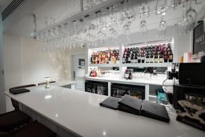 a bar with a white counter in a room at Shore Hotel Laxey in Laxey
