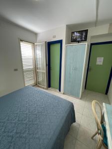 Postel nebo postele na pokoji v ubytování Albergo Désirée
