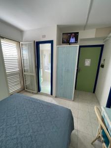 Postel nebo postele na pokoji v ubytování Albergo Désirée