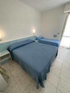 Postel nebo postele na pokoji v ubytování Albergo Désirée