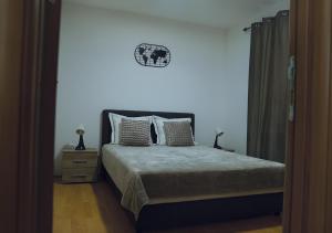 Krevet ili kreveti u jedinici u okviru objekta Aster Apartments