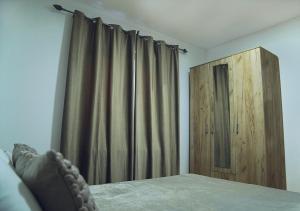 Krevet ili kreveti u jedinici u okviru objekta Aster Apartments
